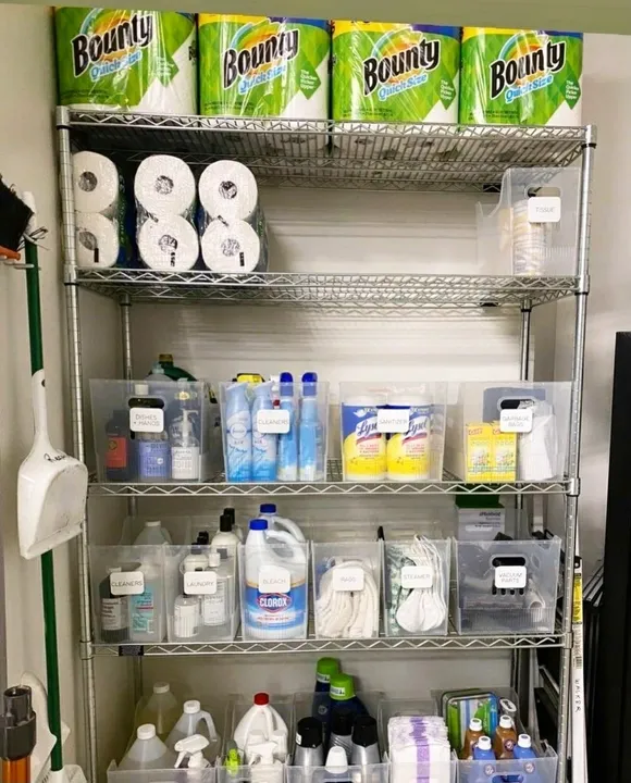 Cleaning supplies sorted into labelled clear bins on wire shelving