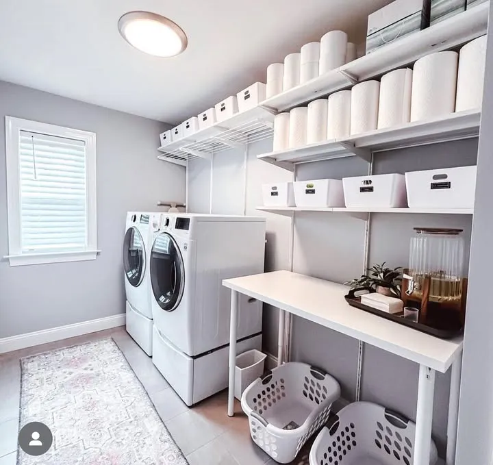 The same laundry room after MOOP organized it, with labelled bins and clear counters