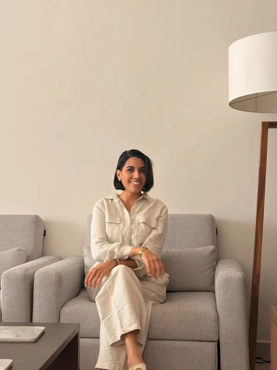 The owner of MOOP, professional home organizer, in a calm organized Vancouver living room
